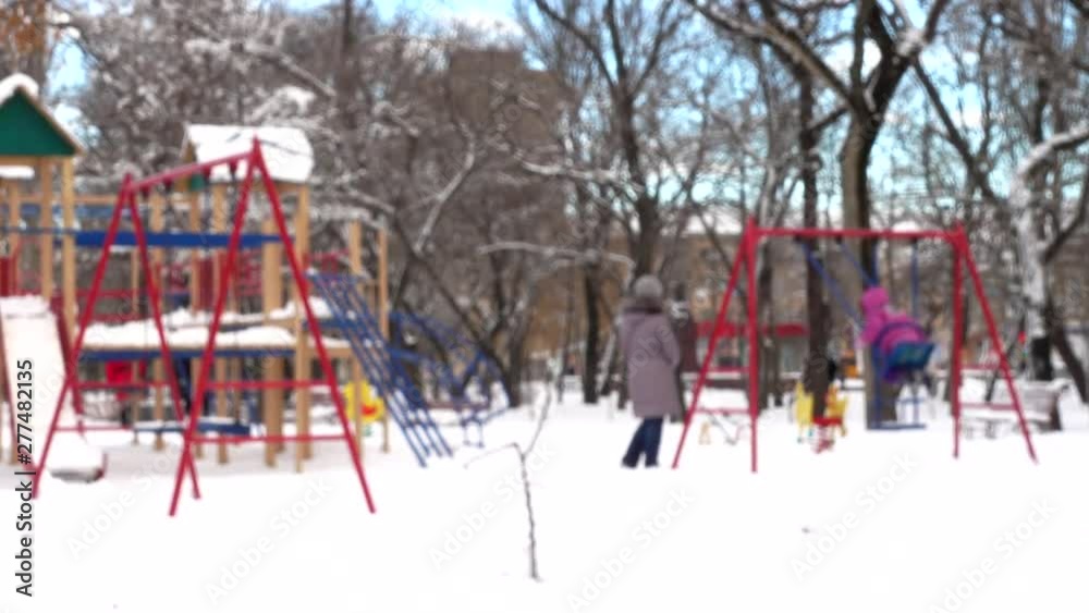 The playground in the winter park. Out of focus. Shooting in the winter. The playground in the winter park. Out of focus. Shooting in the winter.
