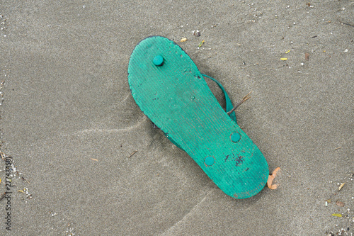 Spilled garbage on the beach of a big city. Empty used dirty plastic bottles, children's plastic toys. Dirty sea, sandy coast the Black Sea. Environmental pollution. Ecological problem. Moving waves