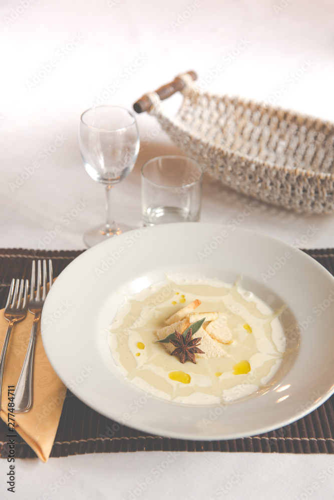 Smashed Potatoes in white plate and star anice Smashed Potatoes in white plate and star anice