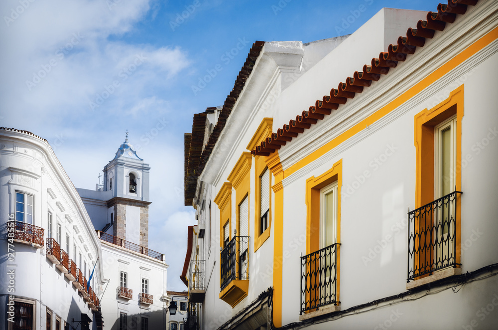 The narrow alleys of Evora, main city of the Alentejo region in Portugal, famous for its traditional white and yellow houses