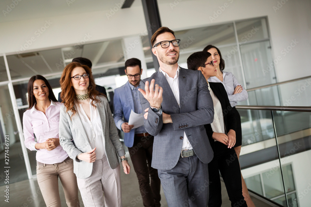 Portrait of business people in offices representing company