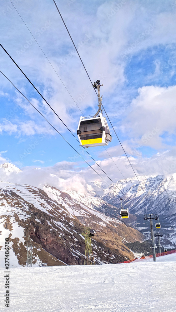 Fototapeta premium Cable car cabin at beautiful slopes of the Caucasus Mountains, Elbrus