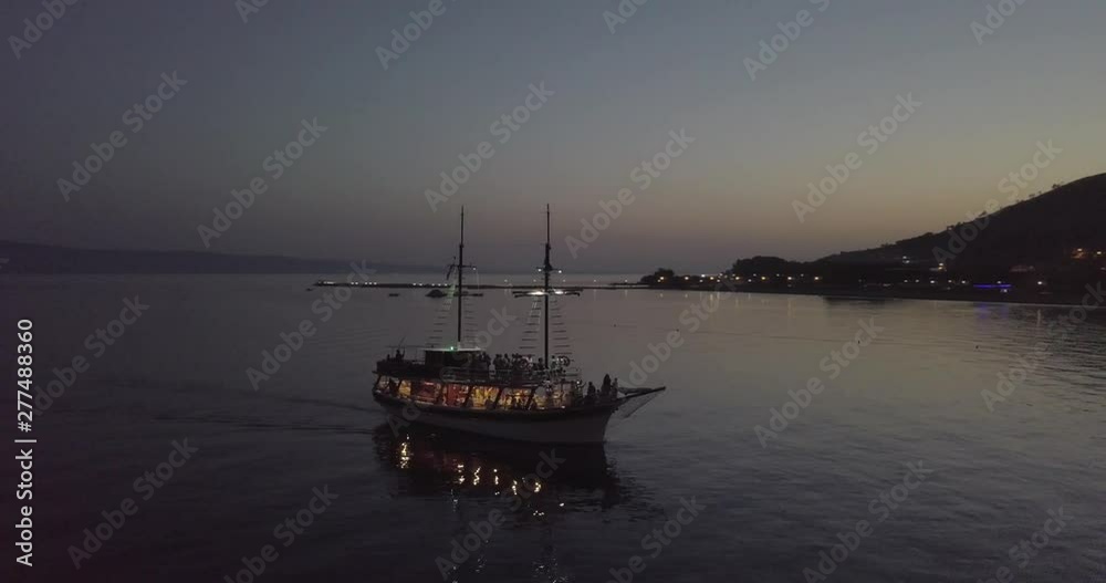 AERIAL: Old boat cruising in Croatia at dusk AERIAL: Old boat cruising in Croatia at dusk