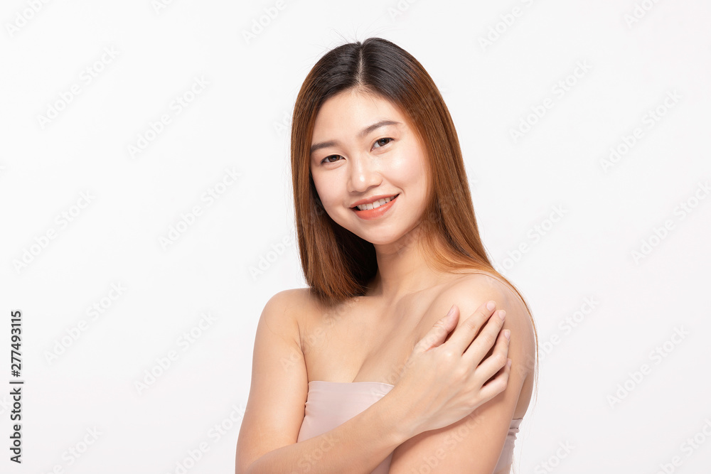 Beautiful Attractive Asian young woman smile with white teeth and touching her shoulder feeling happiness and cheerful with Healthy Clean Skin,Isolated on white background,Beauty Cosmetology Concept Beautiful Attractive Asian young woman smile with white teeth and touching her shoulder feeling happiness and cheerful with Healthy Clean Skin,Isolated on white background,Beauty Cosmetology Concept
