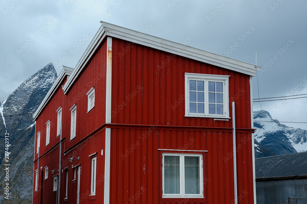 Typical red rorbu fishing huts with sod roof on Lofoten islands in Norway Typical red rorbu fishing huts with sod roof on Lofoten islands in Norway