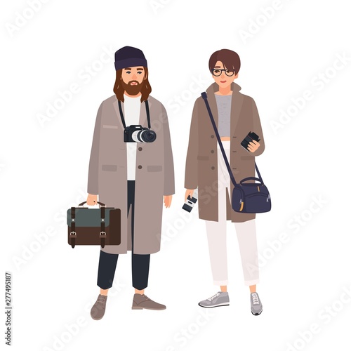 Portrait of male photographer and his female assistant in coats isolated on white background. Pair of professional photo journalists with cameras standing together. Flat cartoon vector illustration.