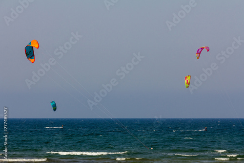 Panoramic view of Deveses beach in Denia with some surf kites in the sky photo