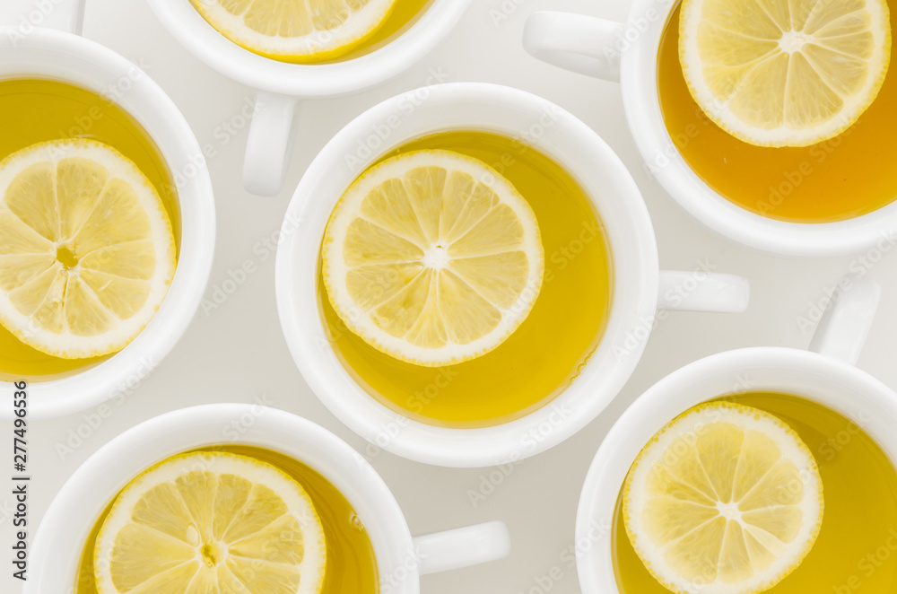 An elevated view of lemon tea cup isolated on white background