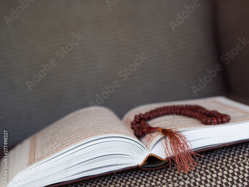 Close up oppened the holy Quran with rosary. Prayer at Hijri New Year, August 30 photo