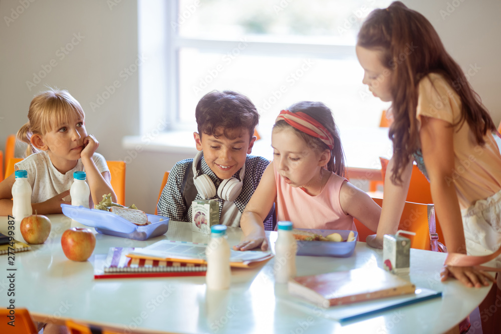 Children feeling good while spending time in canteen together Children feeling good while spending time in canteen together