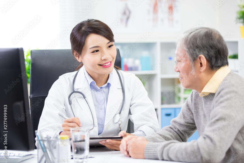 Female doctor see elder patient Female doctor see elder patient