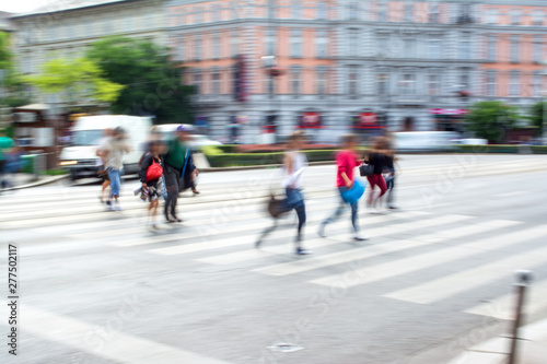 Busy city people going along the street. Intentional motion blur © vbaleha