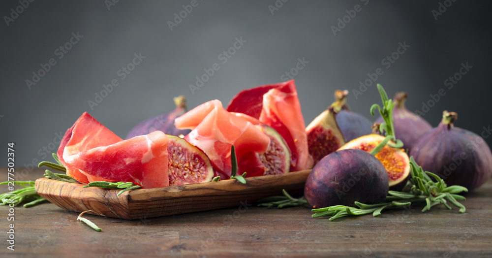 Prosciutto with figs and rosemary. - obrazy, fototapety, plakaty 