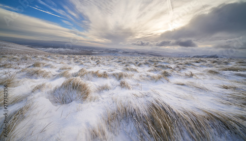 Frozen windscwept grassland near the summit of Bowscale Fell in the Lake District.
