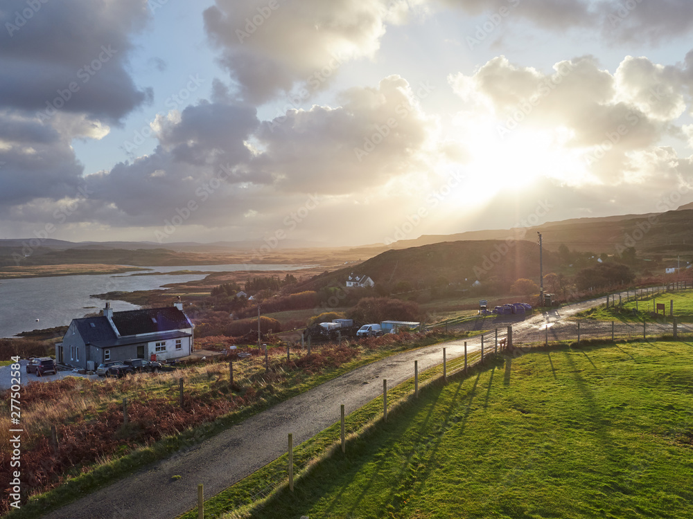 Views across Colbost and Loch Dunvegan at sunrise on the Isle of Skye in the Scottish Highlands. Views across Colbost and Loch Dunvegan at sunrise on the Isle of Skye in the Scottish Highlands.
