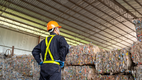 Фотография Engineer check recycled plastic product the waste recycling plant,Recycling is processing used materials