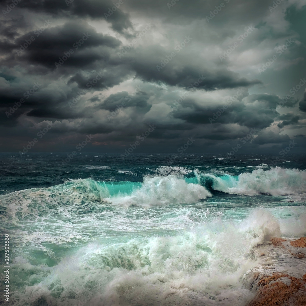 Fototapeta premium Stormy sea view near coastline at evening time. Waves, splashed