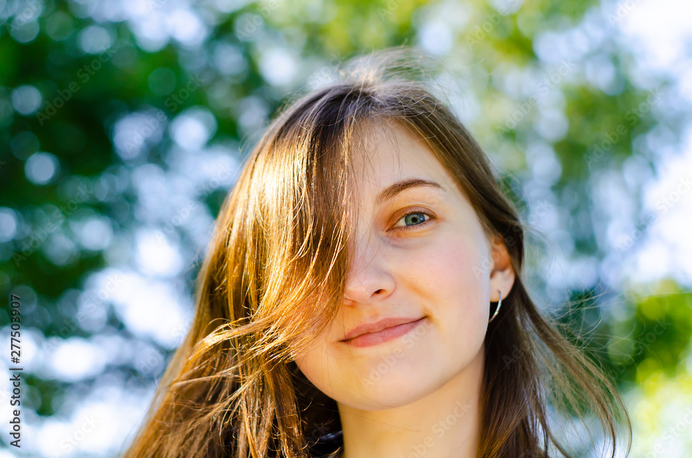Beautiful girl, brown hair. Smiles. Forest, summer. Beautiful girl, brown hair. Smiles. Forest, summer.