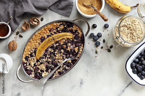 Schilderij op canvas Super seedy vegan baked oatmeal with blueberries and caramelized banana