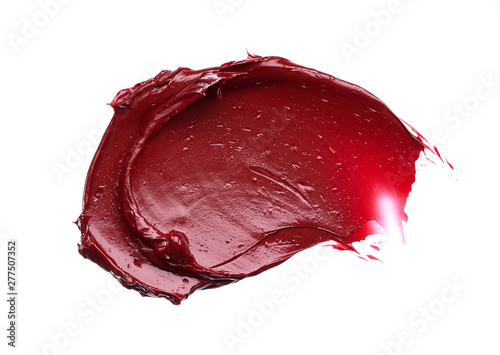 Smear and texture of red lipstick or acrylic paint isolated on white background.