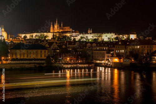 Night view of Prague castle and Charles Bridge over Vltava river in Prague, Czech Republic. Prague