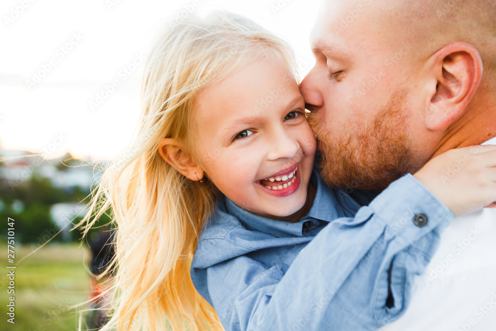 Happy father and child spending time outdoors. Beautiful blonde daughter. Happy father and child spending time outdoors. Beautiful blonde daughter.