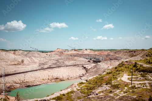 Coal mining at an open pit in the daytime
