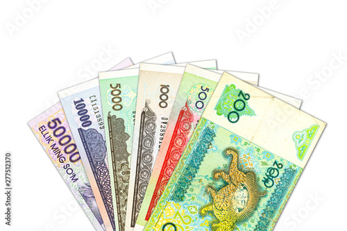 Bild auf Leinwand some Uzbek Som banknotes indicating growing economy with copyspace