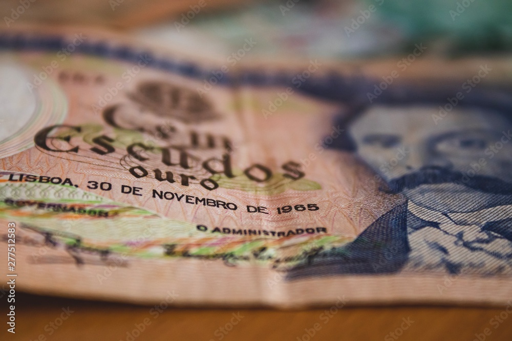 Fototapeta premium passport and moneyOld Portuguese money bill. Banco de Portugal. Escudos were the money from Portugal before Euro. 
