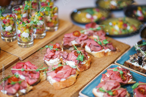 Canapes and light meals, tapas on the table in the restaurant.