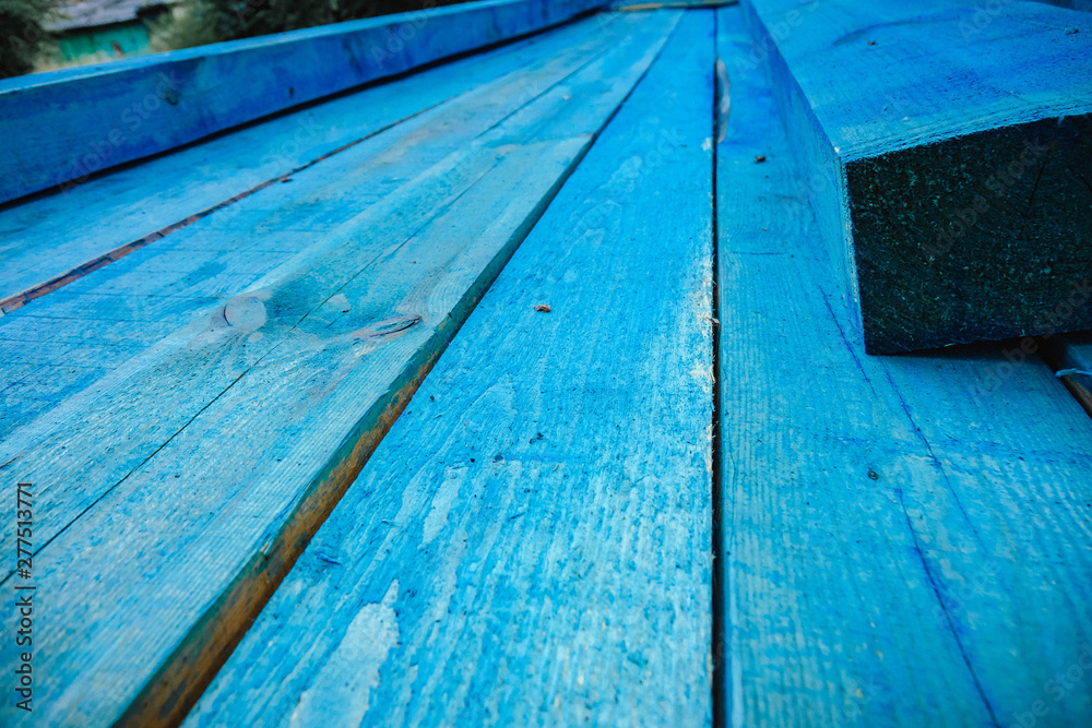 blue boards lying on top of each other. building construction concept