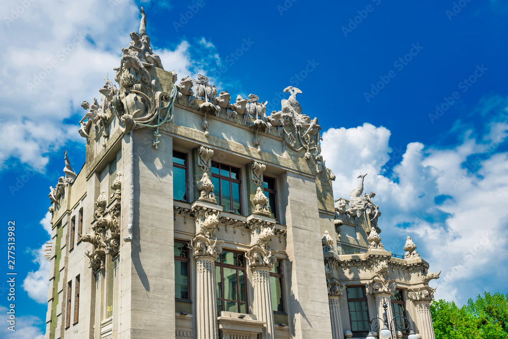 Famous House with Chimaeras - beautiful Art Nouveau building with animal figures decoration at sunny day at blue sky background. Kiev, Ukraine