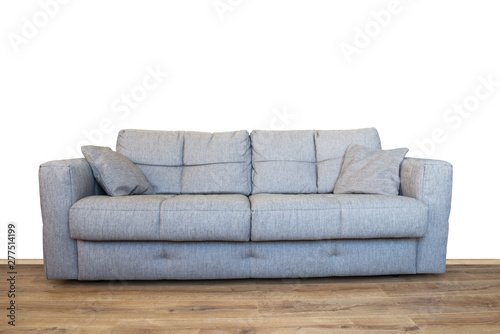 Modern gray sofa or couch furniture on wooden floor isolated with white wall background