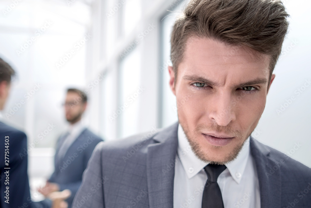 close up.portrait of a serious young businessman close up.portrait of a serious young businessman