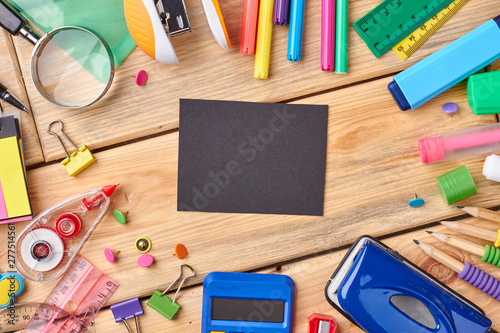 Office and student accessories on wooden background. Stationery, school accessories. Concept of education.