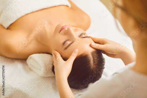 Face woman massage close up in a beauty clinic. photo