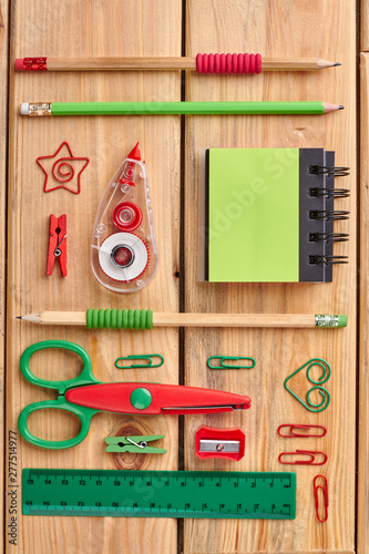 Different school supplies on the wooden background. Work, business and education concept.