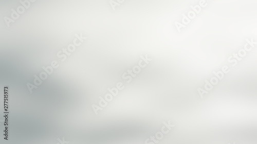 Gray abstract blurred dark gradient background with light blue spots.