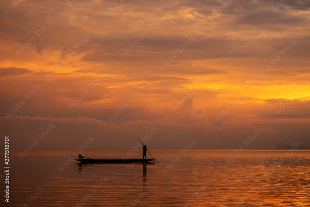 Minimal silhouette fisherman on the lake with twilight sky.