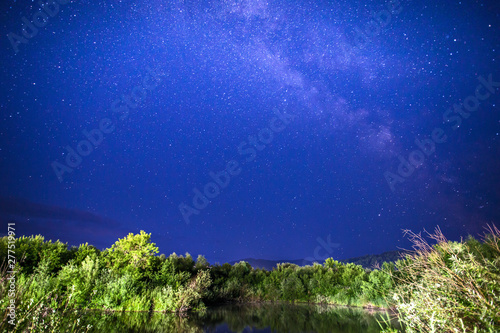 night landscape by the lake with stars