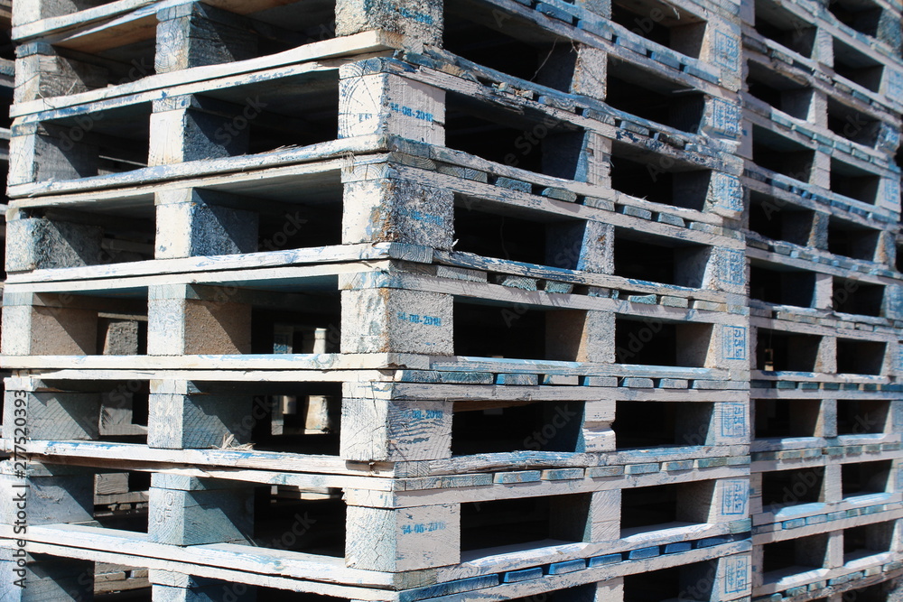 Detail of wooden pallets stocked at an industrial yard Detail of wooden pallets stocked at an industrial yard