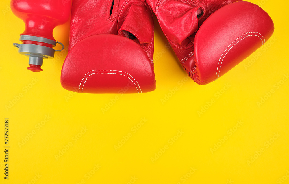pair of red leather boxing gloves