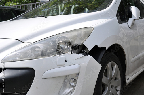The consequence of a car accident. Damaged bumper and head optics