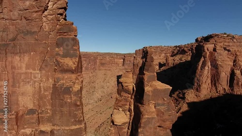 Flying up to reveal beautiful tall red sandstone rock formations. photo