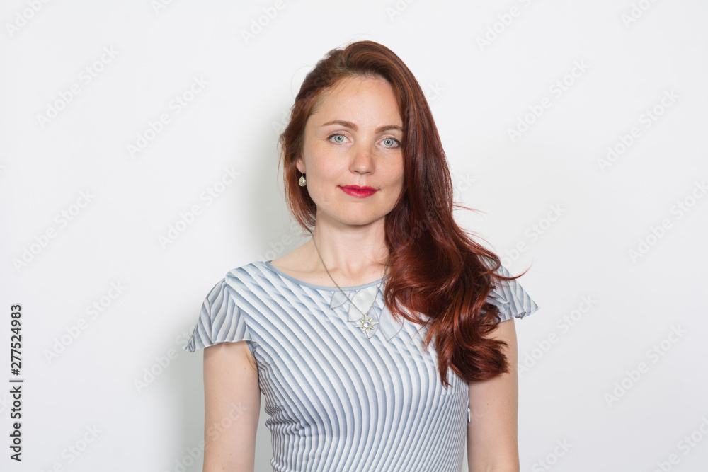 Closeup portrait of a red-haired woman isolated over white background Closeup portrait of a red-haired woman isolated over white background