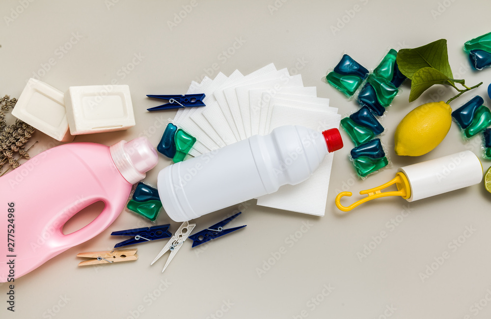 various detergents and the necessary attributes for cleaning, washing and ironing in the background. copy space various detergents and the necessary attributes for cleaning, washing and ironing in the background. copy space