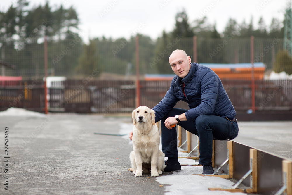 Pet owner man and dog golden retriever labrador Pet owner man and dog golden retriever labrador