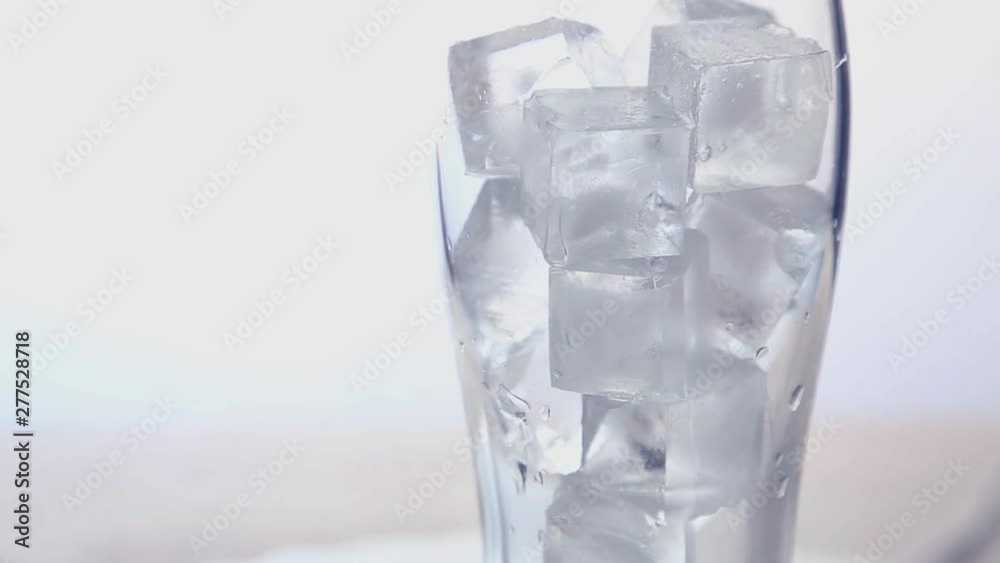 Video of rotating glass with ice cubes Video HD Close up Video of rotating glass with ice cubes Video HD Close up