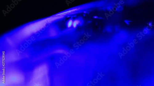 Extreme Close Up Of Pouring Carbonated Water Into A Glass. photo
