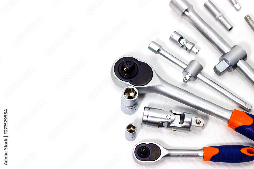 A set of tool heads for loosening screws, bolts and nuts. Ratchet screwdriver. White background